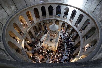Orthodox Christian worshippers gather at the rooftop above the Tomb of Christ at the Church of the Holy Sepulchre in Jerusalem.   EPA 