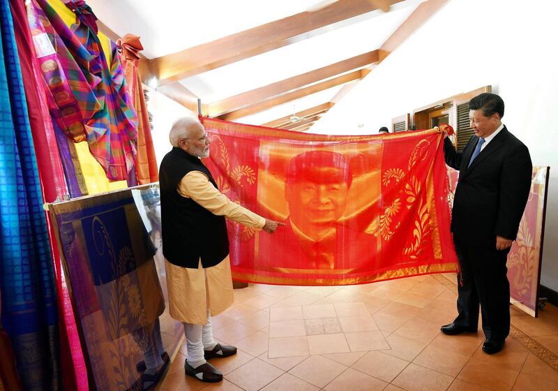 India's Prime Minister Narendra Modi and China's President Xi Jinping exchange gifts. AP