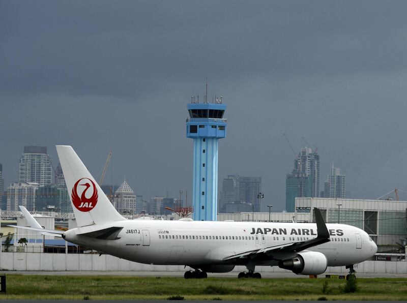 epa05412333 A Japan Airlines (JAL) plane prepares to take off at Manila's international airport, Philippines, 07 July 2016. According to a Manila International Airport Authority (MIAA) official, domestic flights in the Philippines were cancelled due to bad weather as Typhoon Nepartak approaches Taiwan. The Joint Typhoon Warning Center website, run by the National Oceanic and Atmospheric Administration of the US government, has classified the approaching storm as a 'Super Typhoon' with wind strength estimated at around 277 kilometers per hour.  EPA/FRANCIS R. MALASIG *** Local Caption *** 52874641