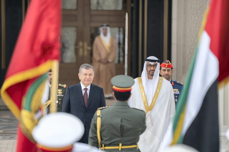 ABU DHABI, UNITED ARAB EMIRATES - March 25, 2019: HH Sheikh Mohamed bin Zayed Al Nahyan, Crown Prince of Abu Dhabi and Deputy Supreme Commander of the UAE Armed Forces (R) and HE Shavkat Mirziyoyev, President of Uzbekistan (L), stand for the national anthem during a reception at the Presidential Palace.

( Rashed Al Mansoori / Ministry of Presidential Affairs )
---