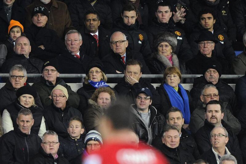 Sir Alex Ferguson, second left in second top row, has been a regular spectator at Manchester United games since stepping down as manager at the end of last season. Rebecca Naden / Reuters