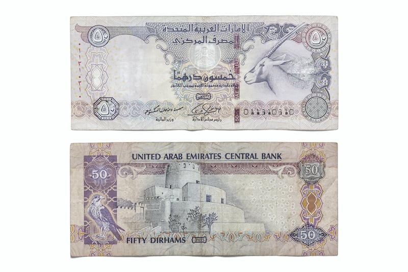 DUBAI, UNITED ARAB EMIRATES. 12 APRIL 2021. United Arab Emirates currency, UAE Money. Fifty Dirham bank note, 50 aed. (Photo: Antonie Robertson/The National) Journalist: Juman Jarallah. Section: National.