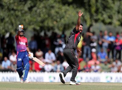 Dubai, United Arab Emirates - January 26, 2019: Imran Haider of the UAE takes the wicket of Aarif Sheikh of Nepal in the the match between the UAE and Nepal in a one day internationl. Saturday, January 26th, 2019 at ICC, Dubai. Chris Whiteoak/The National