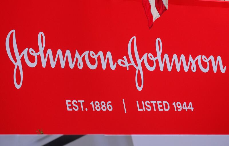 FILE PHOTO: The company logo for Johnson & Johnson is displayed to celebrate the 75th anniversary of the company's listing at the New York Stock Exchange (NYSE) in New York, U.S., September 17, 2019. REUTERS/Brendan McDermid/File Photo