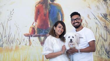 Shruti and Pradeep with their baby pet Cheendu at their own home in Dubai South.  Leslie Pableo for The National
