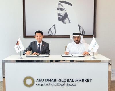 Dhaher Al Mheiri, chief executive of Abu Dhabi Global Market and Michael Chan, chief executive of Zand Bank signed the preliminary agreement. Photo: ADGM 