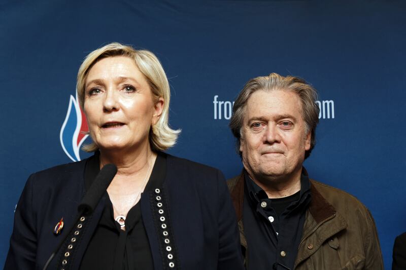 Marine Le Pen and former US president Donald Trump's adviser, Steve Bannon, give a joint press conference at the Front National party's annual congress in March 2018.