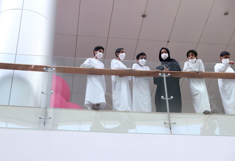 People watch the display from above. The event took place at Yas Mall's Pearl Court.