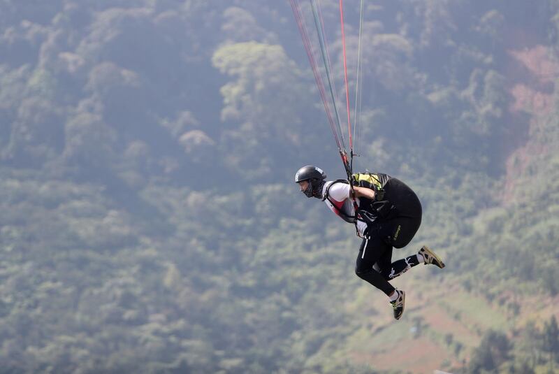 Seong Min Lee of South Korea in action during a training session for the Paragliding competition of the Asian Games in Bogor, Indonesia. EPA