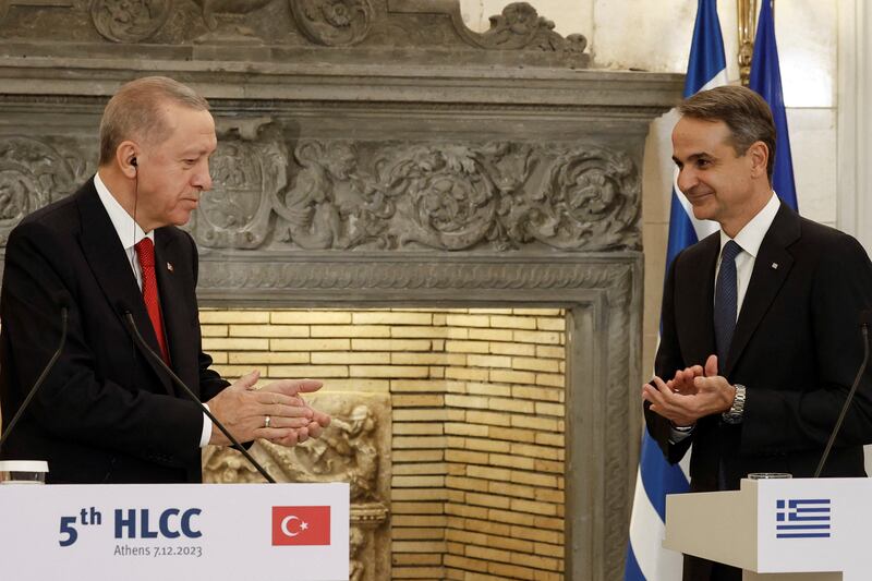 Mr Erdogan and Mr Mitsotakis applaud their new partnership. Reuters