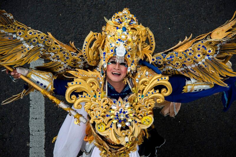 A model parades a design with the theme of 'Asia Light' during the Jember Fashion Festival in Jember, East Java province. Juni Kriswanto/AFP