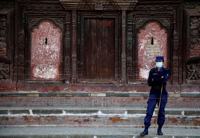 A policeman stands guard near a polling station in Kathmandu, a day ahead of the parliamentary and provincial elections in Nepal. Navesh Chitrakar / Reuters