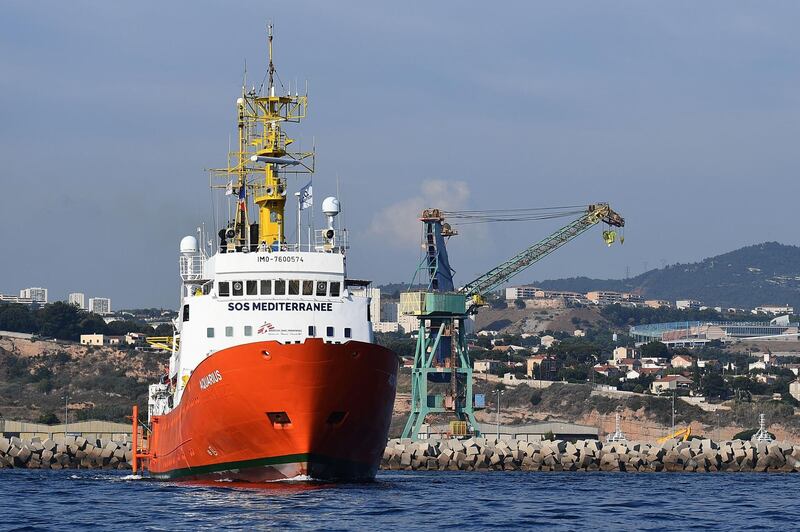 The rescue ship Aquarius, chartered by French aid group SOS Mediterranee and Doctors Without Borders (MSF), leaves the harbour of Marseille, southeastern France, on August 1, 2018, after having been docked for a month for maintenance work. 
The French NGO operating the rescue ship Aquarius, which precipitated a European political crisis in June after both Italy and Malta blocked it from docking with 630 migrants aboard, said on August 1 that nothing would stop it from rescuing migrants from the Mediterranean as its ship prepared to resume its mission off the Libyan coast. / AFP PHOTO / BORIS HORVAT