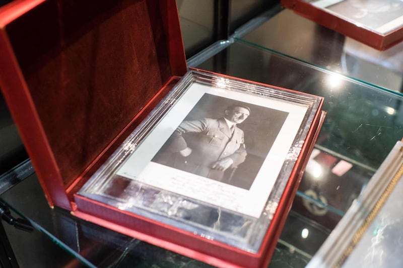 A framed portrait of Adolf Hitler at an auction of Nazi memorabilia, including Adolf Hitler's top hat, that raked in hundreds of thousands of euros in Munich. AFP