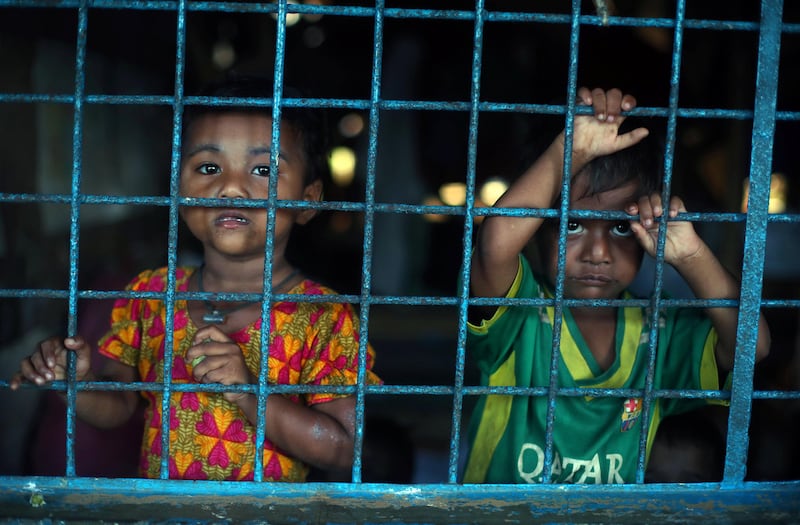 Rohingya refugee children, who crossed the border from Myanmar this week, take shelter at Long Beach Primary School, in the Kutupalong refugee camp, near Cox's Bazar, Bangladesh October 23, 2017. REUTERS/Hannah McKay