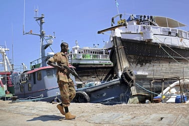 A Somali soldier on patrol in Bosaso harbour in Somalia. A car bombing in the city was aimed at advancing Qatar's interests in the country against the UAE. AFP