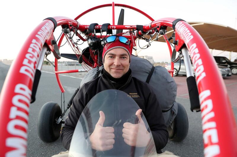 DUBAI, UNITED ARAB EMIRATES , January 13 – 2021 :- Pilot Alexandr Ctitor getting ready to fly after the sunrise at the Paramotor Desert Adventure Aviation Club on Dubai- Al Ain road in Dubai. (Pawan Singh / The National) For News/Online. Story by Sarwat