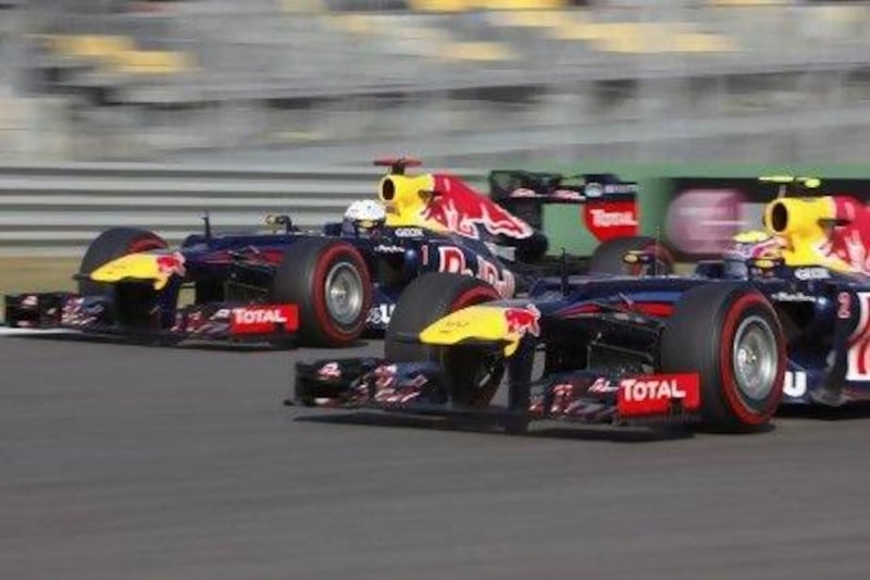 Red Bull Formula One drivers Sebastian Vettel, left, and Mark Webber during a practice session at the Korea International Circuit in the Yeongam province. Woohae Cho / Reuters