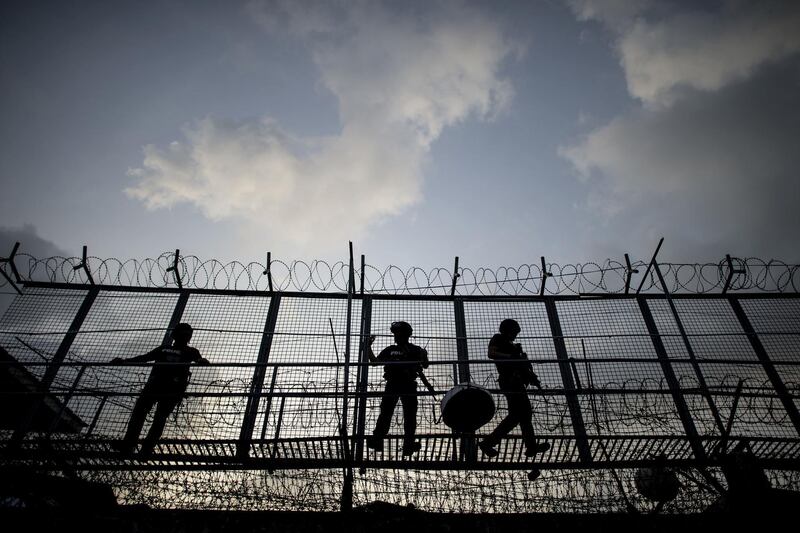 Prison officers keep watch during an anti-drug and contraband inspection at Manila City's jail. AFP