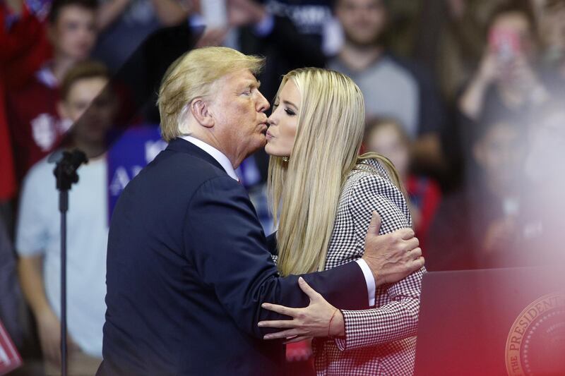 U.S. President Donald Trump, left, kisses Ivanka Trump, assistant to President Trump, during a rally with U.S. President Donald Trump in Fort Wayne, Indiana, U.S., on Monday, Nov. 5, 2018. Trump kicked off his last day of campaigning ahead of elections that will determine control of Congress, as he tweeted support for Republican candidates and condemned their Democratic opponents. Photographer: Luke Sharrett/Bloomberg