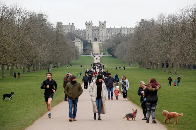 Windsor castle is seen as people walk on the Long Walk, amid the outbreak of the coronavirus disease (COVID-19), in Windsor, Britain, March 7, 2021. REUTERS/Peter Cziborra