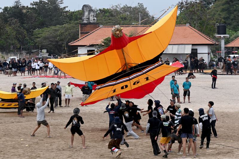 A giant kite is launched during the Bali Kite Festival at Mertasari beach in Sanur, Bali, Indonesia. AFP