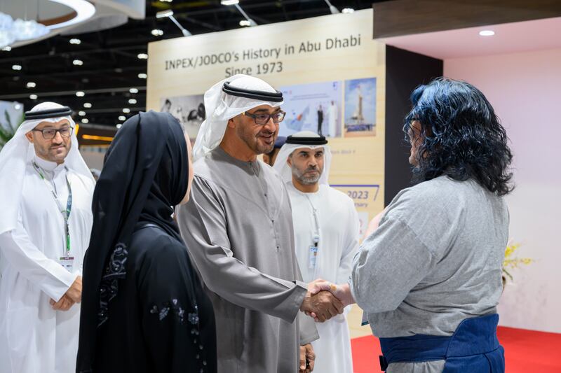 President Sheikh Mohamed greets an exhibitor during his tour on the third day of Adihex. Abdulla Al Neyadi / UAE Presidential Court
