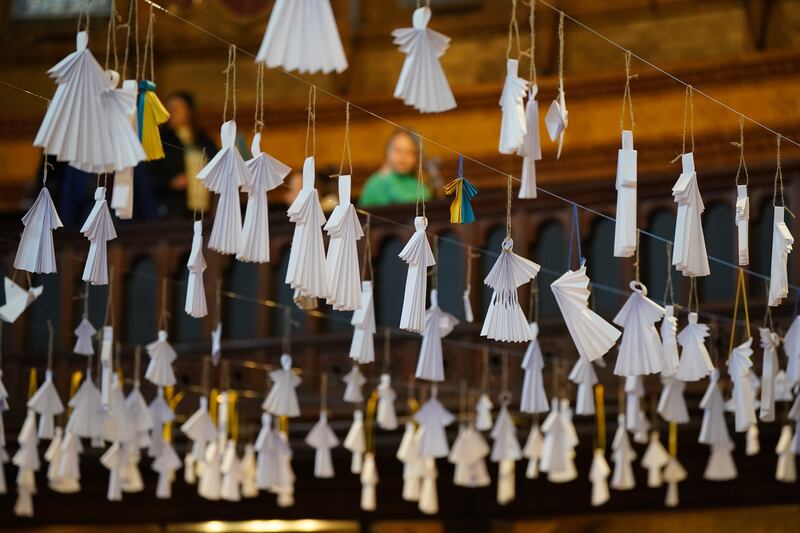 A tribute consisting of 461 paper angels hangs from the roof of the Ukrainian Catholic Cathedral in London, one for each child that has died in the past year according to the official statistics. PA