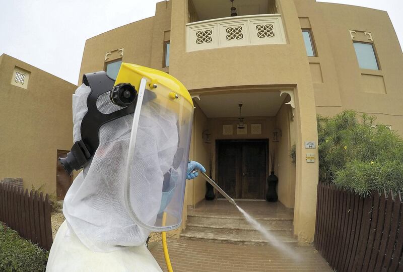 DUBAI, UNITED ARAB EMIRATES , April 11 – 2020 :- Dubai Municipality worker disinfecting the streets in Al Furjan area in Dubai. Dubai is conducting 24 hours sterilisation programme across all areas and communities in the Emirate and told residents to stay at home. UAE government told residents to wear face mask and gloves all the times outside the home whether they are showing symptoms of Covid-19 or not. (Pawan Singh/The National) For News/Online/Instagram/Standalone