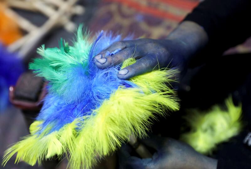 Workers in the feather industry collect birds' feathers, then wash and colour them, before creating colourful cleaning products.