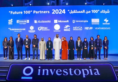 Abdulla bin Touq, Minister of Economy, with the new partners of the updated Future 100 programme for start-ups at the Investopia conference in Abu Dhabi. Victor Besa / The National