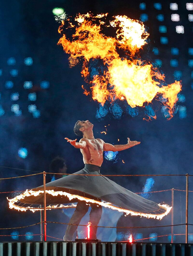 A member of the cast performs with fire during the Opening Ceremony for the 2012 Paralympics in London, Wednesday Aug. 29, 2012. (AP Photo/Matt Dunham) *** Local Caption ***  London Paralympics Opening Ceremony.JPEG-00b23.jpg