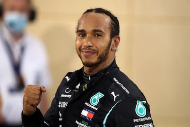 (FILES) In this file photo taken on November 29, 2020 Mercedes' British driver Lewis Hamilton gestures after winning the Bahrain Formula One Grand Prix at the Bahrain International Circuit in the city of Sakhir on November 29, 2020. World champion Lewis Hamilton has tested positive for coronavirus and will miss this weekend's Sakhir Grand Prix in Bahrain, Formula One's governing body FIA announced Tuesday. / AFP / POOL / TOLGA BOZOGLU