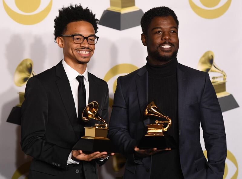 Dwan Hill and Alvin Love III, winners of Best Gospel Performance/Song for 'Never Have To Be Alone' pose in the press room. AFP