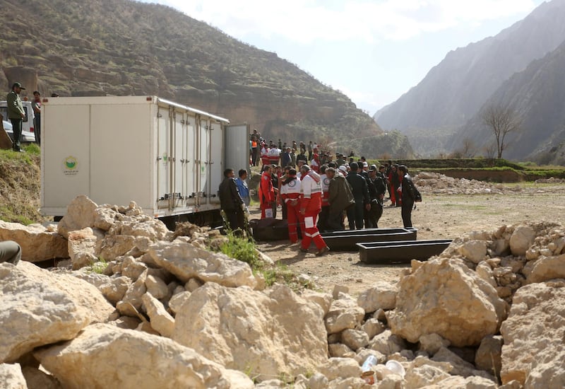 People gather near the site of a private plane crash, Iran. Tasnim News Agency / Reuters