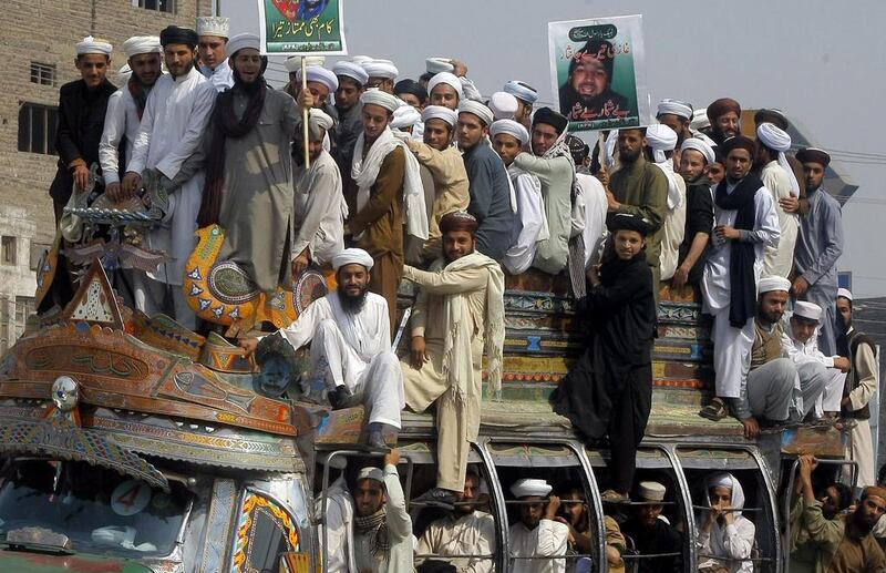 Pakistani supporters of Mumtaz Qadri on February 29, 2016, protest his execution in Peshawar, Pakistan. Qadri, the convicted killer of a former governor, shot in 2011 by his bodyguard who accused him of blasphemy, was hanged by the government on Monday. Mohammad Sajjad / Associated Press
