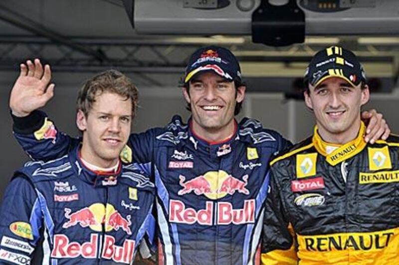 Mark Webber, the pole-sitter, centre, flanked by Robert Kubica, right, who starts second and Red Bull teammate Sebastian Vettel, who starts third.