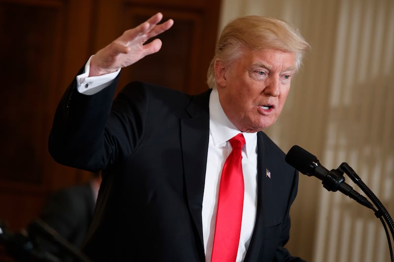 US president Donald Trump speaks in the East Room of the White House in Washington on January 27, 2017. Evan Vucci / AP Photo