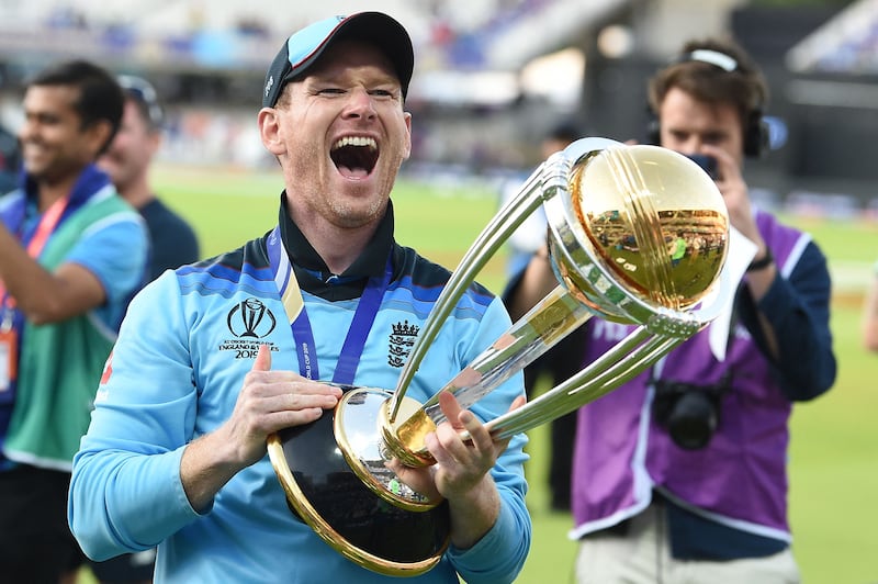England captain Eoin Morgan celebrates with the World Cup trophy after defeating New Zealand in the 2019 final at Lord's. AFP