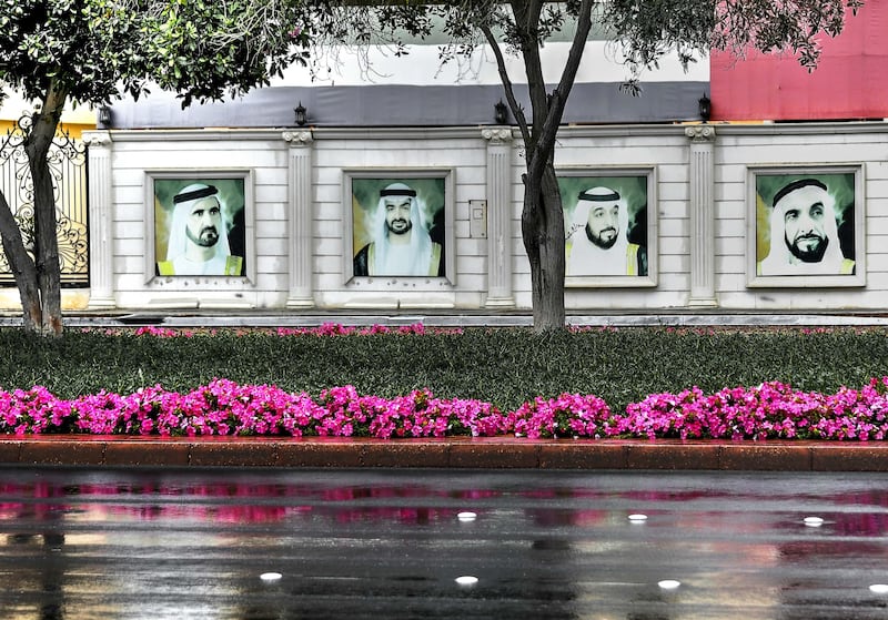 Andy Anderson, American, ���A Rare Rainy Day��� Images of the UAE Founding Fathers are framed on the walls of a villa in Al Bateen as the street glistens with a recent rain.
