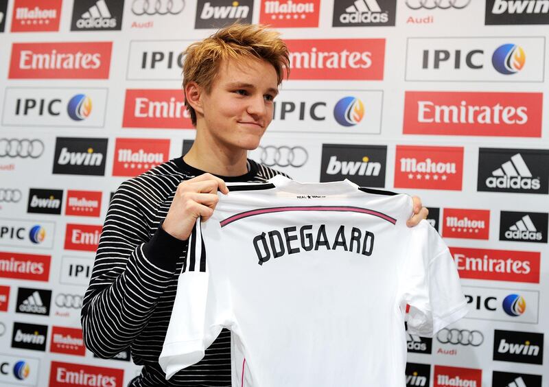 MADRID, SPAIN - JANUARY 22:  Martin Odegaard from Norway holds his new Real Madrid shirt during a press conference at Real Madrid's Valdebebas training grounds after he signed with Real on January 22, 2015 in Madrid, Spain. Odegaard aged 16 will play for Real's second team Real Madrid Castilla and had been linked with many of Europe's top clubs.  (Photo by Denis Doyle/Getty Images)