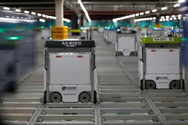 Robots operating on the grid of the 'smart platform' at the Ocado CFC in Andover, southern England. Reuters