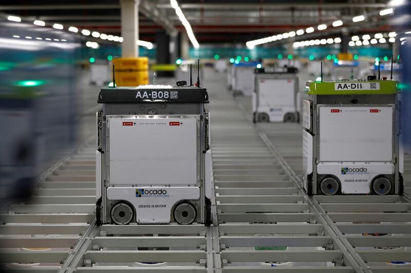 FILE PHOTO: Robots operating on the grid of the "smart platform" at the Ocado CFC (Customer Fulfilment Centre) in Andover, Britain May 1, 2018. Picture taken May 1, 2018.  REUTERS/Peter Nicholls/File Photo