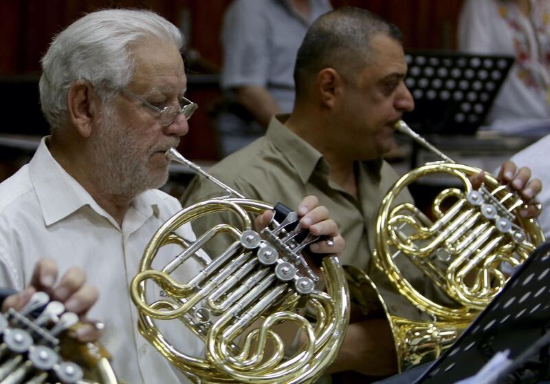 Iraqi National Symphony Orchestra musicians take part in a rehearsal at Baghdad's School of Music and Ballet. AFP