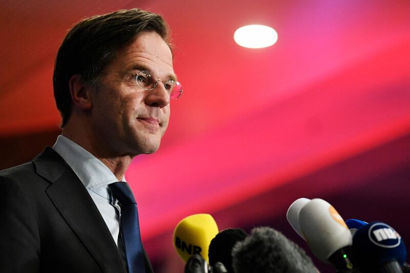 Outgoing Dutch Prime Minister Mark Rutte reacts to the exit pools of the House of Representatives' elections in the Hague, on March 17, 2021. Dutch Prime Minister Mark Rutte's party won the most seats in elections dominated by the coronavirus pandemic, putting him on course to lead his fourth coalition, exit polls said on March 17, 2021. / AFP / POOL / PIROSCHKA VAN DE WOUW
