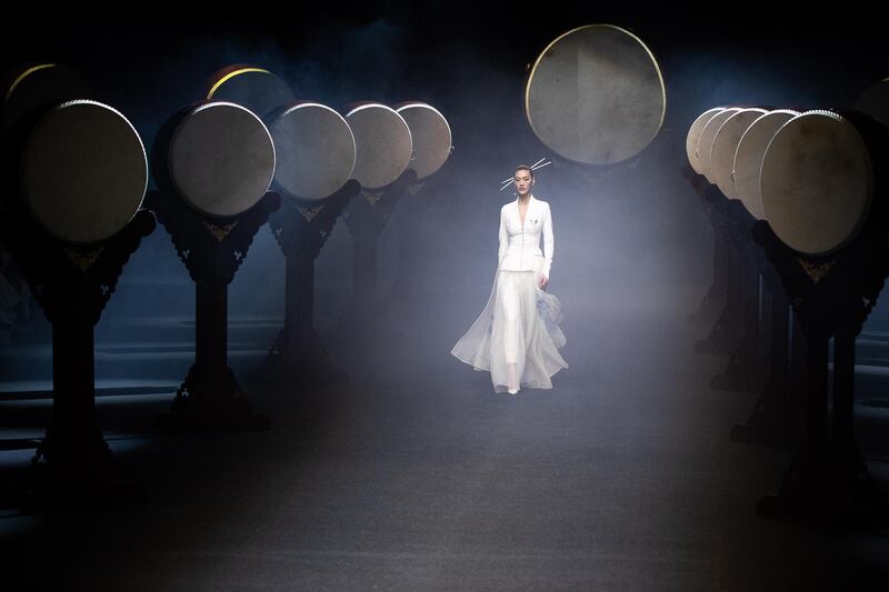 A model exhibits creations at the Heaven Gaia by Xiong Ying show during China Fashion Week in Beijing. EPA