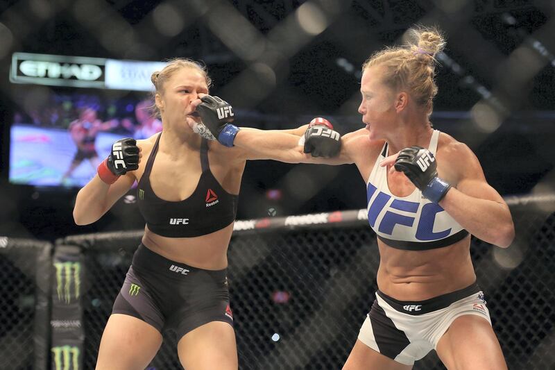 MELBOURNE, AUSTRALIA - NOVEMBER 15:  Ronda Rousey of the United States (L) and Holly Holm of the United States compete in their UFC women's bantamweight championship bout during the UFC 193 event at Etihad Stadium on November 15, 2015 in Melbourne, Australia.  (Photo by Quinn Rooney/Getty Images)