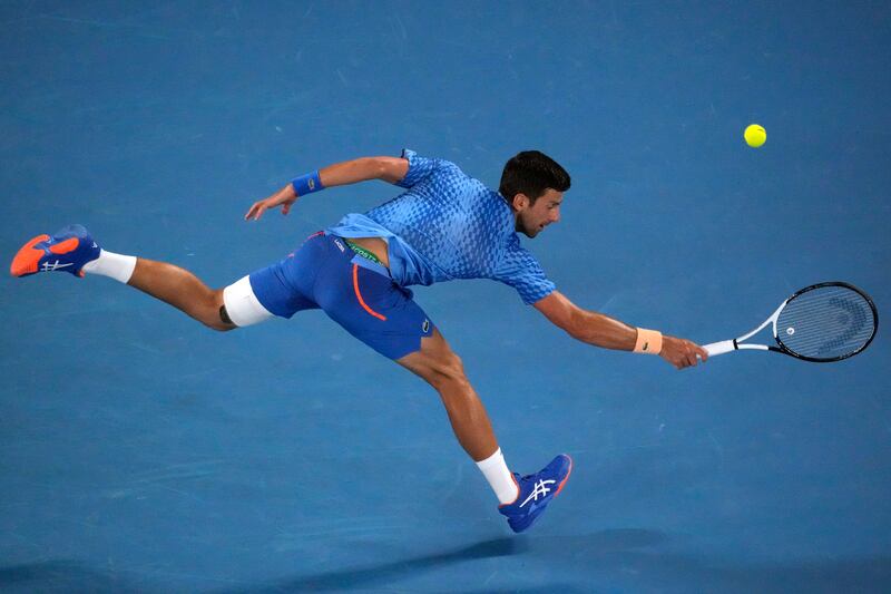 Novak Djokovic stretches for a backhand return. AP 