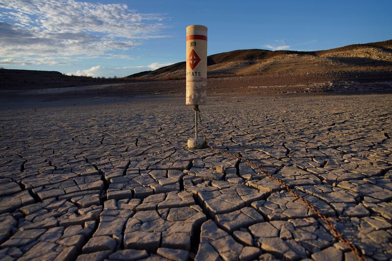 A buoy sits high and dry on cracked earth previously under the waters of Lake Mead at the Lake Mead National Recreation Area near Boulder City, Nevada.  AP Photo