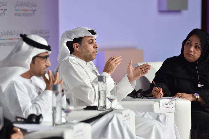 Mohammed Al Hammadi, editor-in-chief of Al Ittihad, left, listens as Dhaen Shaheen, director general for publishing, Dubai Media Inc, and editor-in-chief of Al Bayan, centre, makes a point. Moderator Aisha Sultan looks on.